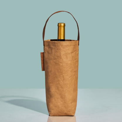 Brown wine bottle bag with a gold wine bottle on a light blue background