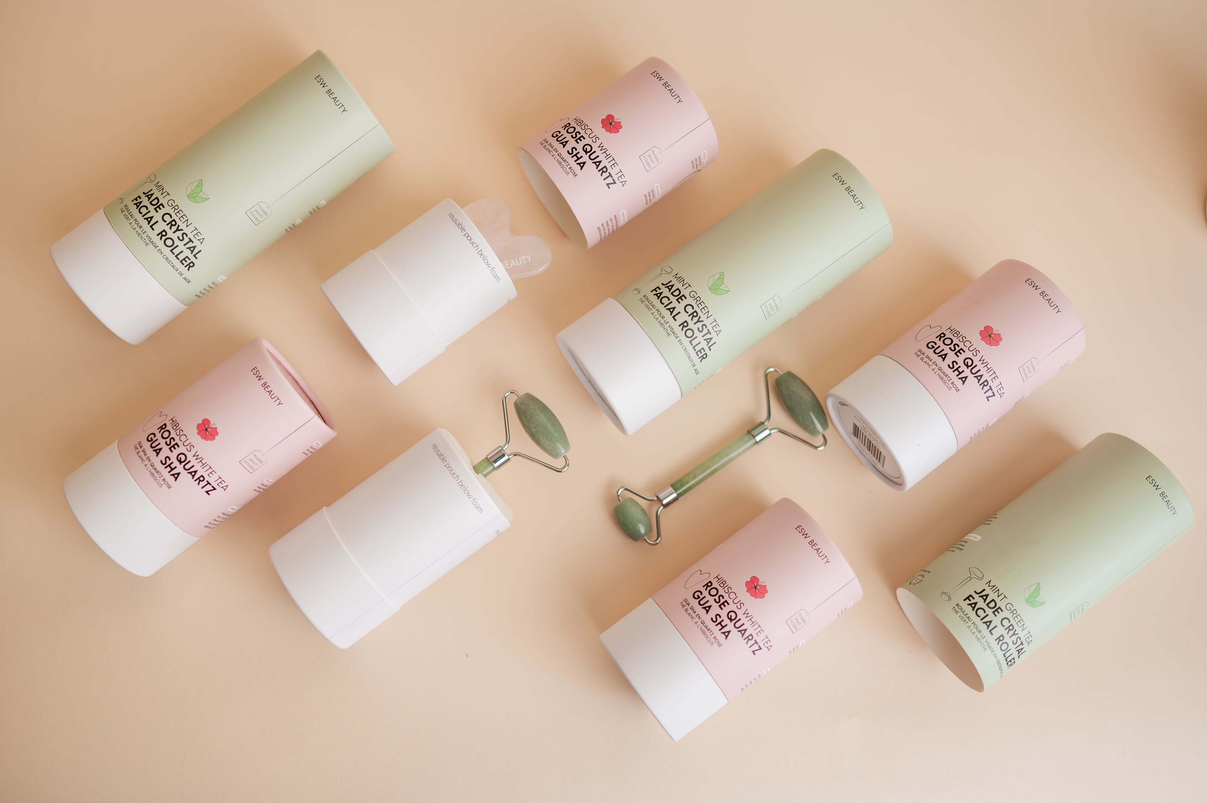 Set of skincare products including bottles and a jade roller 