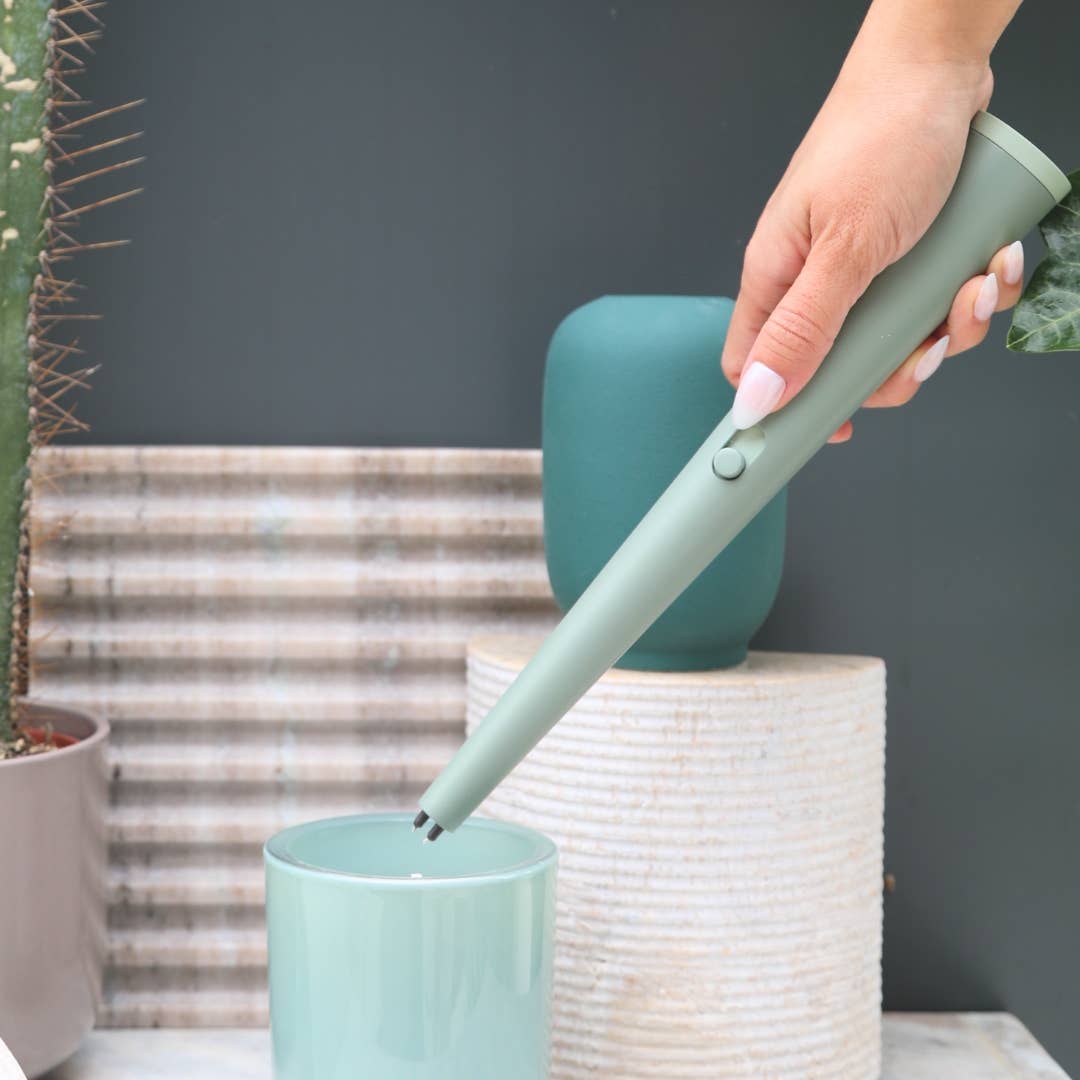 Person using a lighter to light a candle