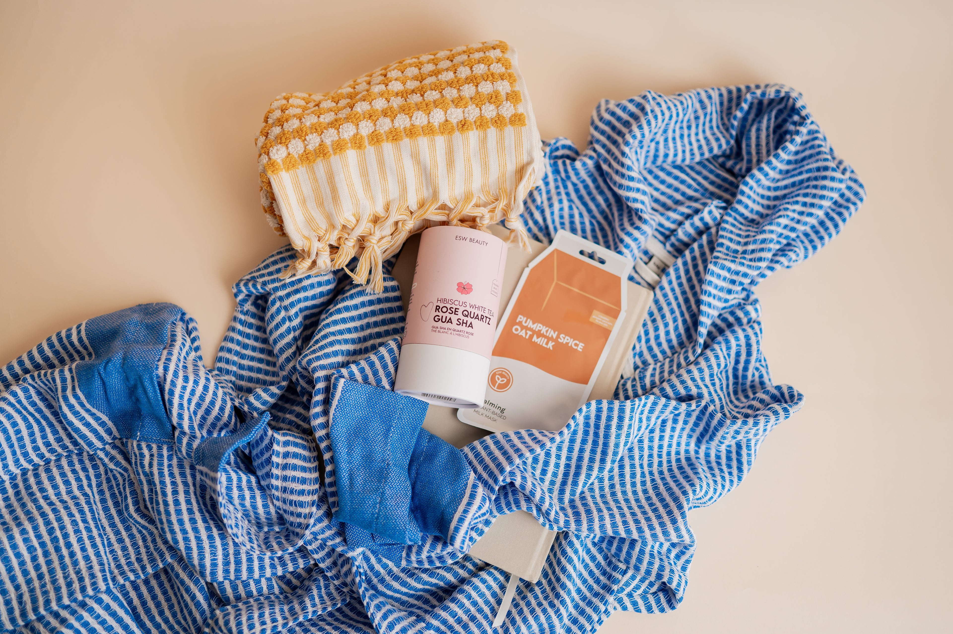 Product with a blue checkered towel on a beige background