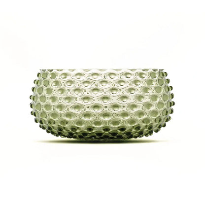 Clear glass bowl with a textured surface on a white background