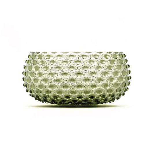 Clear glass bowl with a textured surface on a white background