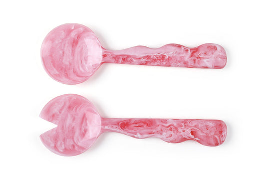 Two pink marbled dumbbells on a white background