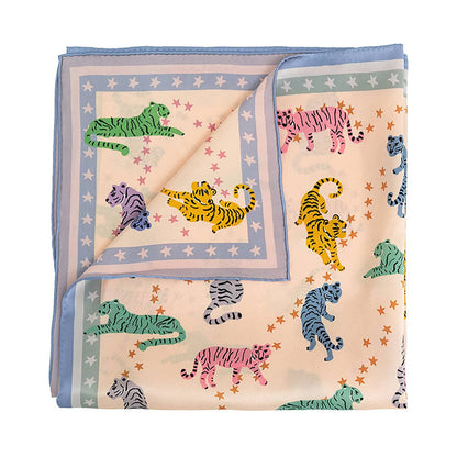 Folded fabric with colorful tiger pattern on a white background