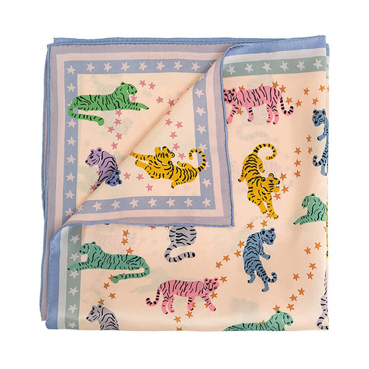 Folded fabric with colorful tiger pattern on a white background